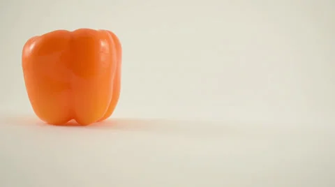 Orange Pepper Against White - Crane Up Stock Footage 22648726