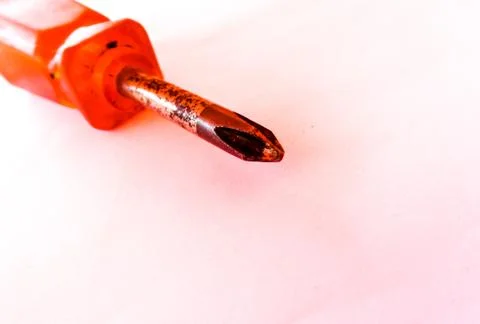 Orange phillips screwdriver closely focused, isolated Stock Photos