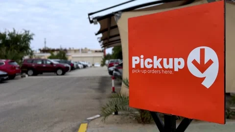 Orange Pickup Orders Sign in Parking Lot Outside Retail Store Entrance Stock-Footage 333443606
