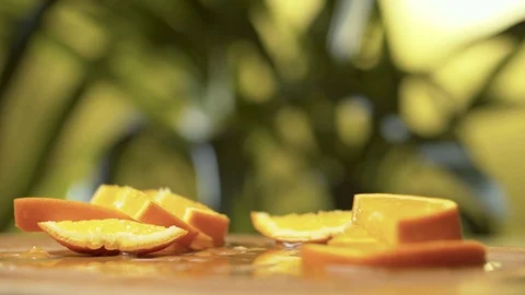 Orange pieces laying on the table Stock Footage 125091981