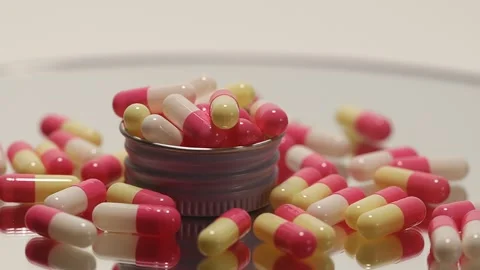 Orange pill onTurntable Stock Footage 250083605