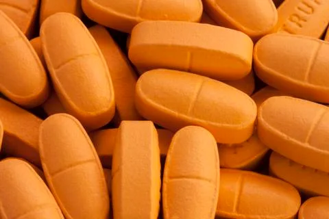 Orange pills Stock Photos