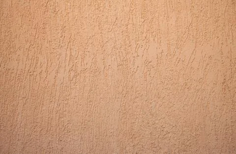 Orange plastered wall with texture Foto stock