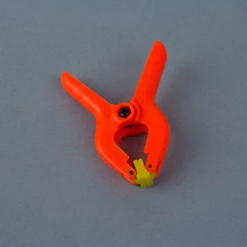 Orange plastic clamp Stock Photos