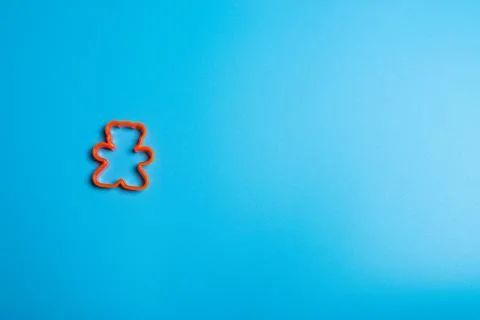 Orange plastic cookie cutter for making cookies in the shape of a teddy bear  Stock Photos