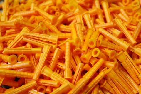 Orange plastic dowels as the background image Foto stock