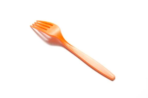 Orange plastic fork Stock Photos