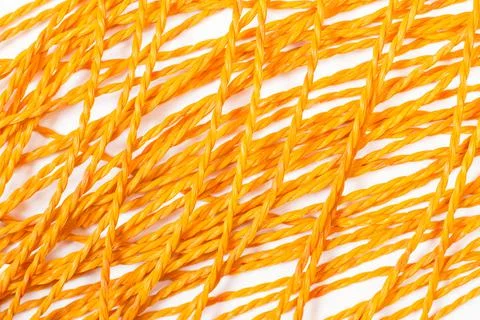 Orange plastic ropes on a white background Stock Photos