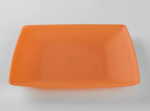 Orange plastic shallow dish food Foto stock