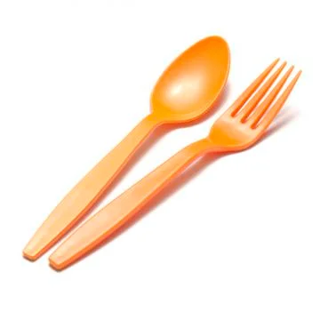 Orange plastic spoon and fork Stock Photos