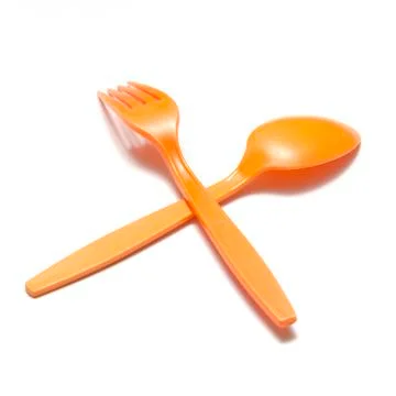 Orange plastic spoon and fork Stock Photos