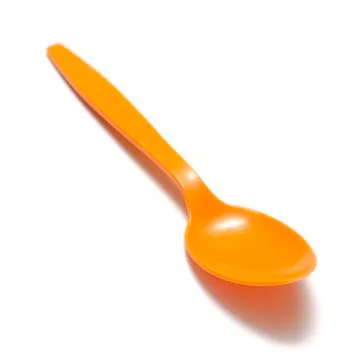 Orange plastic spoon Foto stock