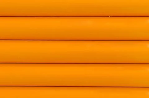 Orange plastic tubing pattern texture background Stock Photos
