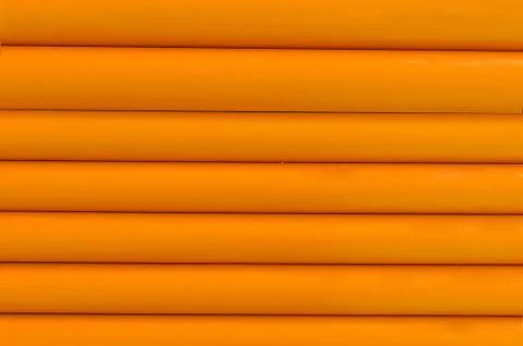 Orange plastic tubing pattern texture background Stock Photos