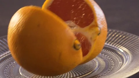 Orange on a plate Stock Footage 124314247