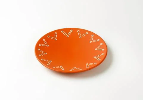 Orange plate with molecular pattern design Stock Photos