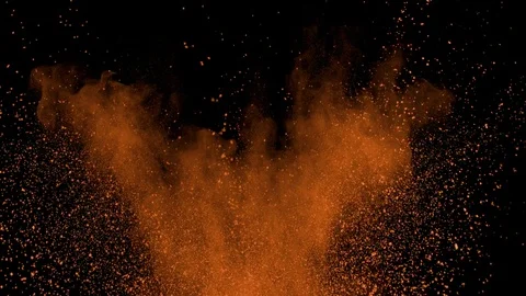 Orange powder exploding on black background in super slow motion, shot with Stock Footage 84299969