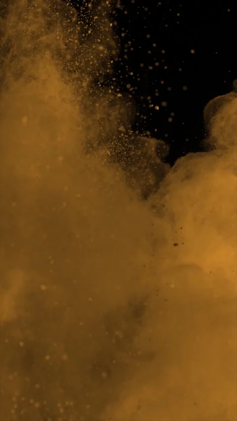 Orange Powder Exploding on Black Background Vertical Video 4k Stock Footage 320070182