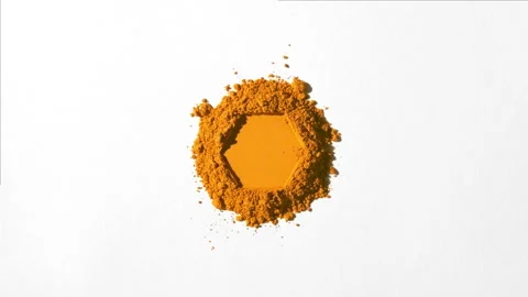 Orange powder stack with hexagonal impression on grey backdrop Stock Footage 341838834