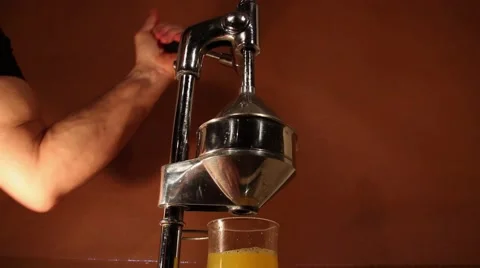 Orange press juicer Stock Footage 60240840