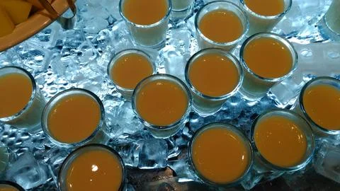 Orange Pudding Dessert Cups on Crushed Ice Display Stock Photos