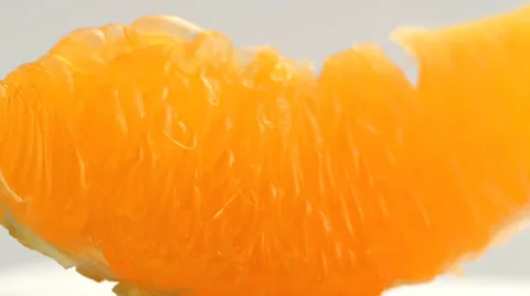 Orange pulp rotating closeup, beautiful soft focus macro shot Stock Footage 46375371