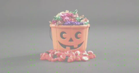 Orange pumpkin bucket with candies while green code rain flickering visualizing Stock-Footage 327784748