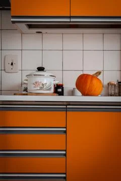 Orange pumpkin lying in kitchen. The pumpkin is prepared for cutting for hallow Stock Photos
