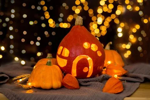Orange pumpkins on the background and blurry lights. halloween concept. Stock Photos