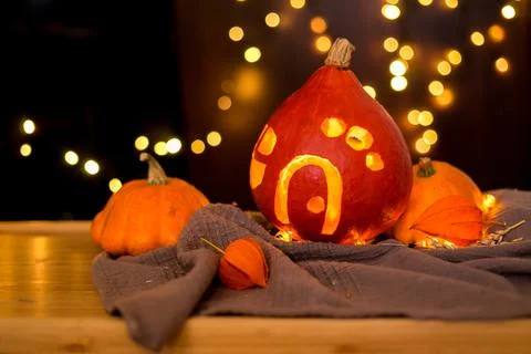 Orange pumpkins on the background and blurry lights. halloween concept. Stock Photos