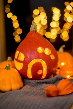 Orange pumpkins on the background and blurry lights. halloween concept. Stock Photos