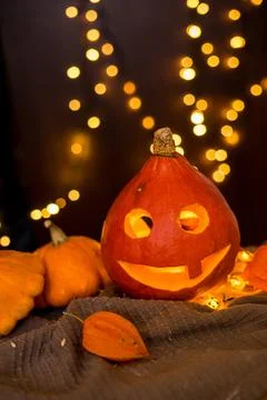 Orange pumpkins on the background and blurry lights. halloween concept. Stock Photos