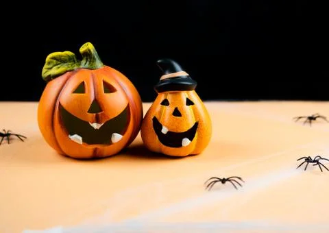 Orange pumpkins on black background. Stock Photos