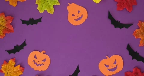 Orange pumpkins shapes, bats, fall leaves and "Happy Halloween" text Stock Footage 345118649