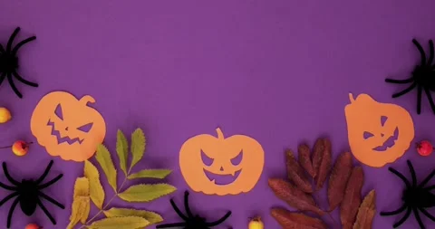 Orange pumpkins shapes, fall leaves, spiders and place for text Stock Footage 345703707