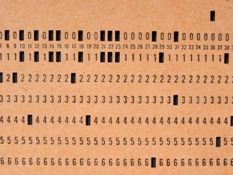 Orange punched card for programming Stock Photos