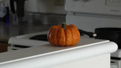 Orange pupmkin in the kitchen table 動画素材 319427286