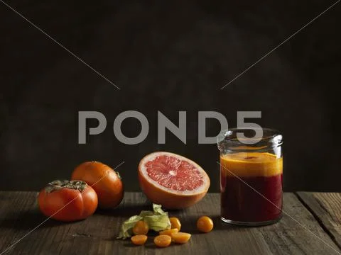 Orange Raw Juice In A Jar With Fruits
