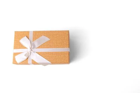 Orange rectangular gift box tied with white ribbon bow isolated on white ba.. Stock Photos