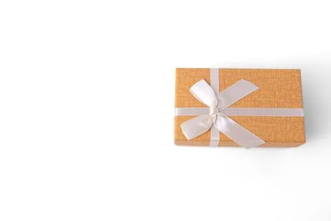 Orange rectangular gift box tied with white ribbon bow isolated on white ba.. Stock Photos