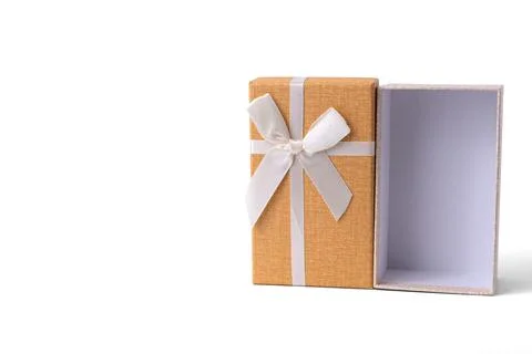 Orange rectangular gift box tied with white ribbon bow isolated on white ba.. Stock Photos