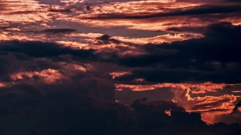 Orange red clouds on a sunny evening time lapse.sunset glow clouds. Video stock 158592553