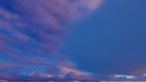 Orange red fiery sky clouds at dusk sunset sunrise time lapse seamless loop Stockbeeldmateriaal 88025887