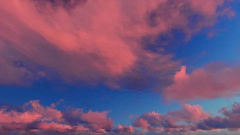 Orange red fiery sky clouds at dusk sunset sunrise time lapse seamless loop Stockbeeldmateriaal 88026006