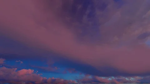 Orange red fiery sky clouds at dusk sunset sunrise time lapse seamless loop Stockbeeldmateriaal 88026305