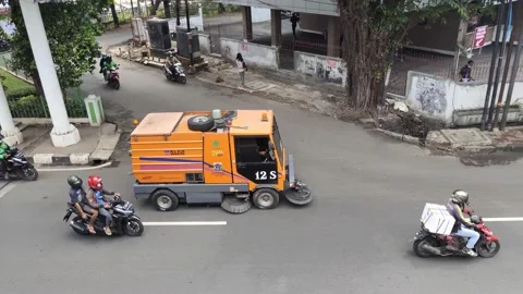 An orange road sweeper car. 스톡 동영상 163859138