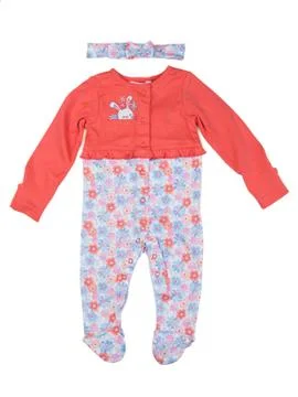 Orange rompers with rabbit pattern. Stock Photos