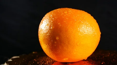 Orange rotate on black background Stock Footage 87214184