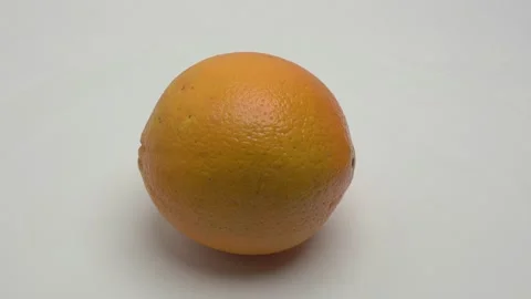Orange rotates on a white background. Видео 265955076