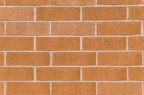 Orange rough brick wall background Stock Photos